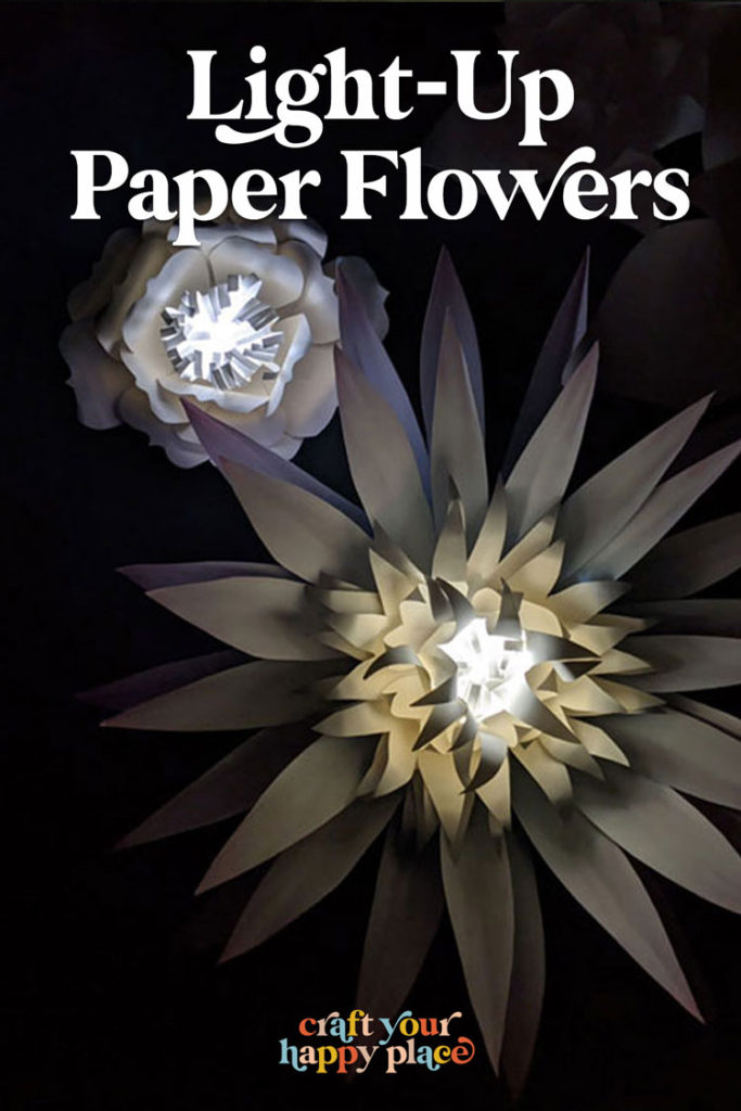 Add a special touch to your paper flower wall with a few DIY paper flower lights. These paper flower lanterns are a super easy DIY paper craft that is affordable and quick to make. 