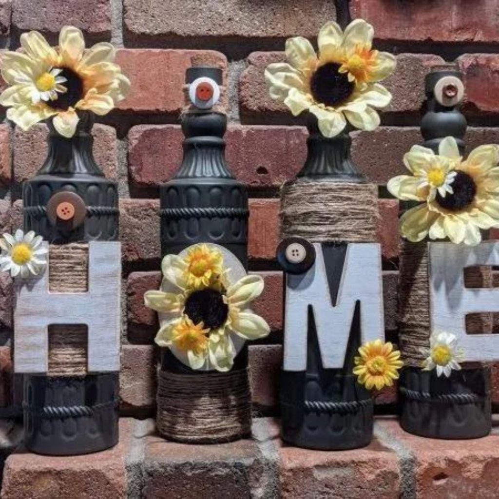 Glass bottle with home lettering and flower