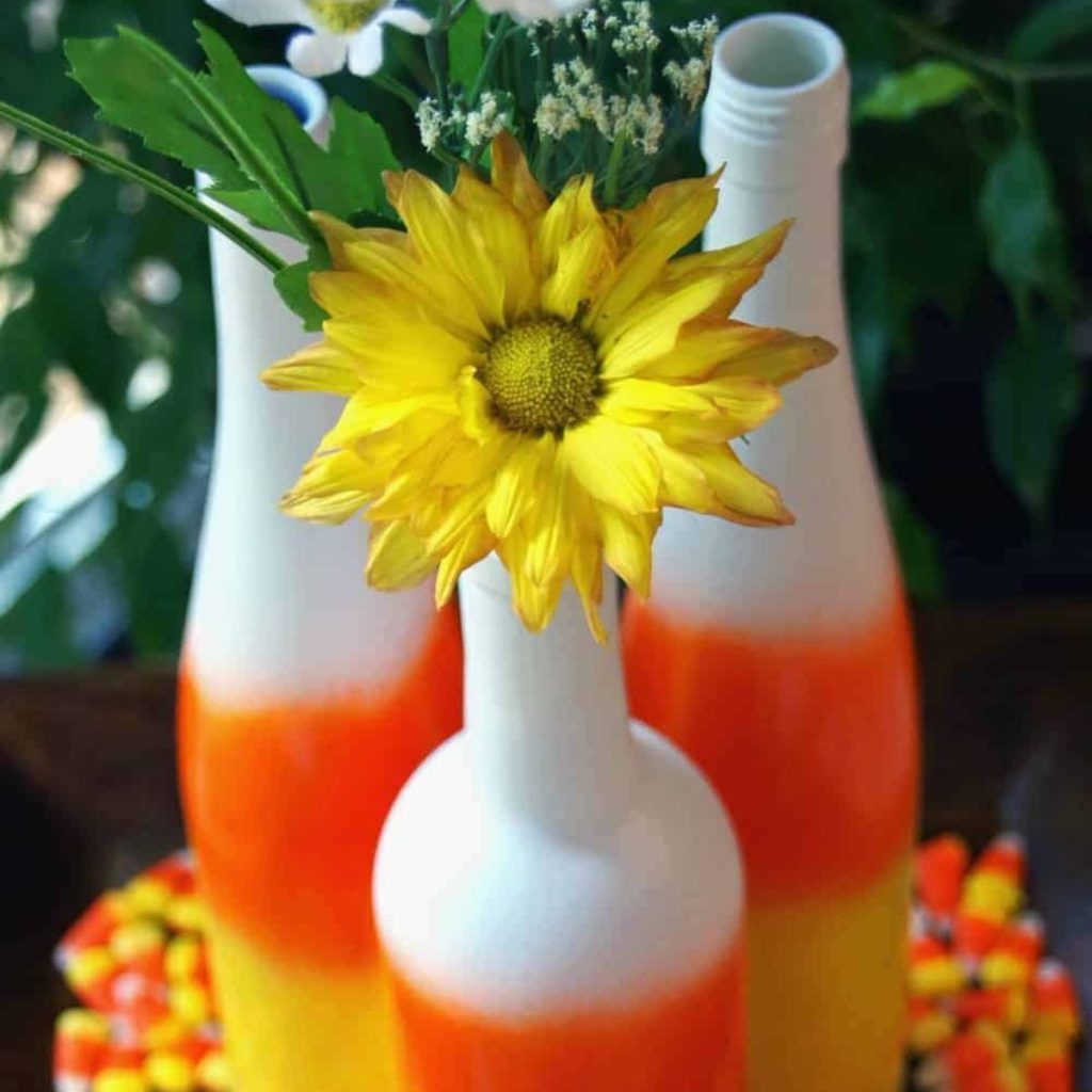 Colorful painted bottle with yellow flower